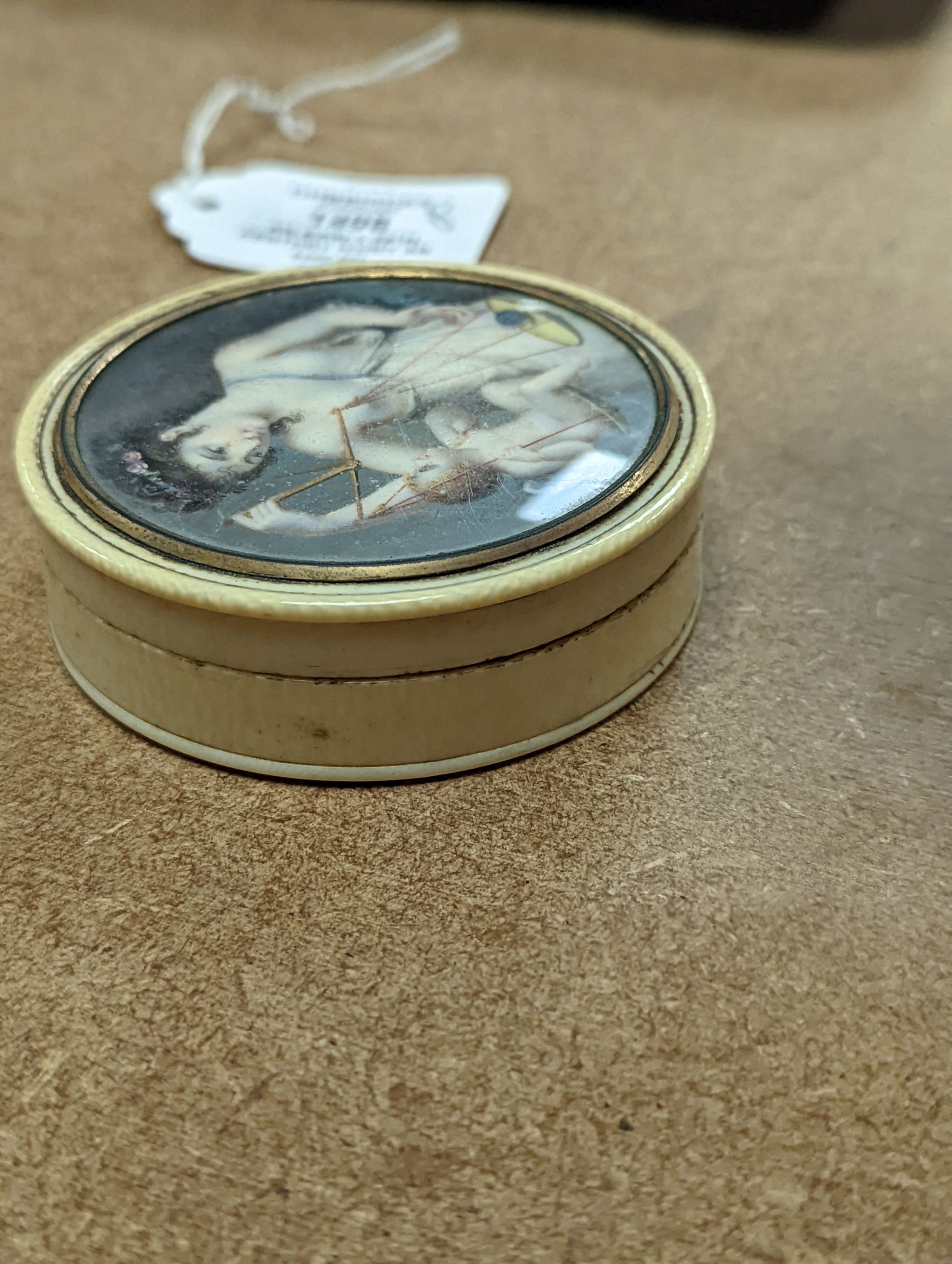 An early 19th century ivory and tortoishell box with inset miniature of Themis to cover, 8cm.